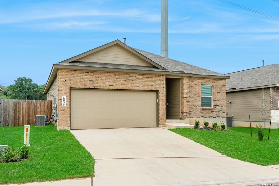 Front exterior of a new home in Hidden Trails, Bulverde, TX, highlighting curb appeal (Image 21).