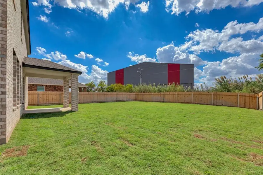 Exterior details and patio area of a home in Mustang Valley, Manor (Image 4).