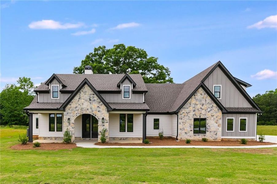 Front exterior of a new home in The Meadows at Lake Circle, Buchanan, GA, highlighting curb appeal (Image 2).