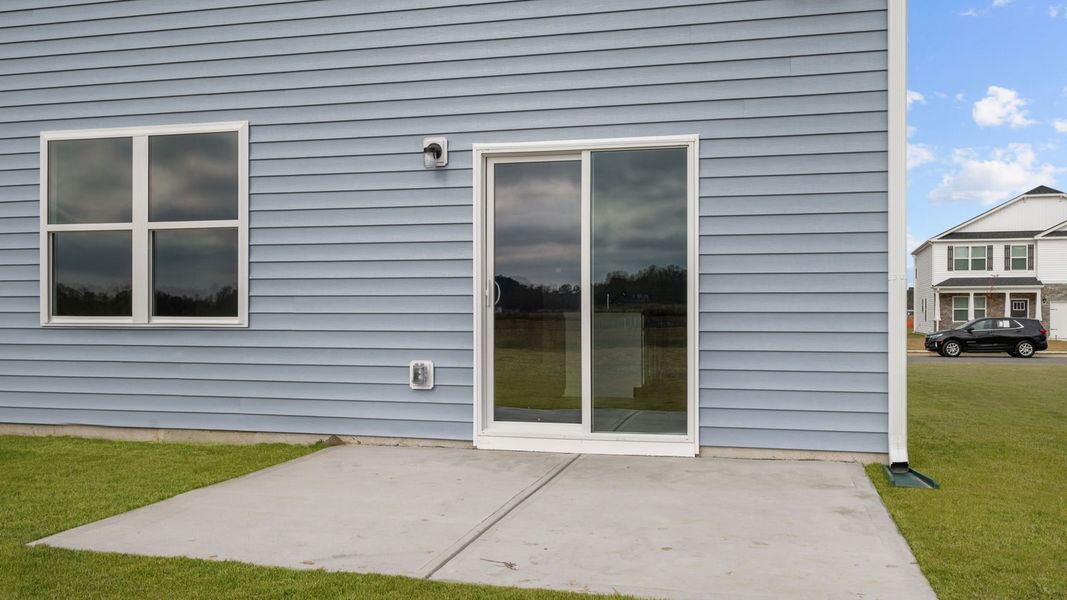 Exterior details and patio area of a home in East Ridge, Ayden (Image 18).