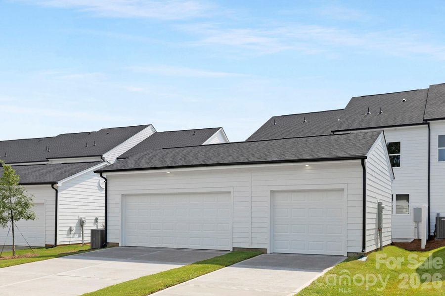 Front exterior of a new home in Edgewood Preserve, Huntersville, NC, highlighting curb appeal (Image 23).