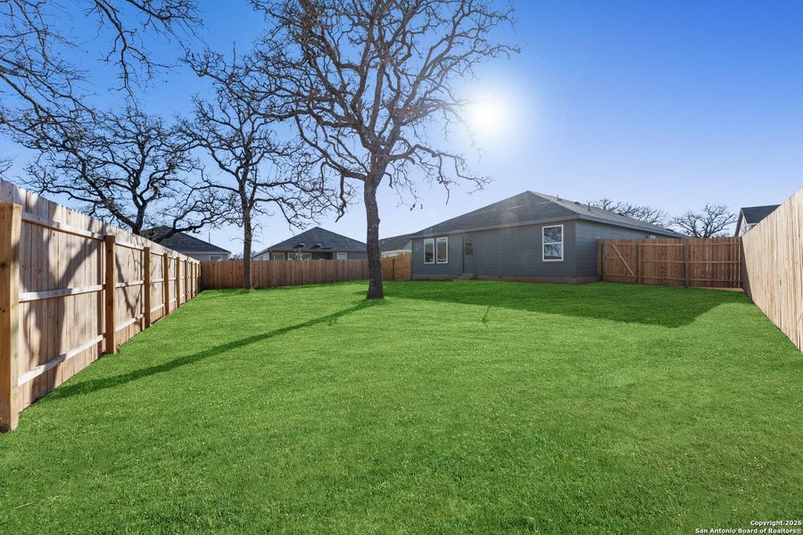 Exterior details and patio area of a home in Friendship Oaks, Fredericksburg (Image 2).
