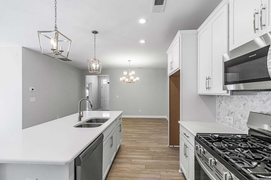 Representative furnished interior of a home built from the Weymouth by Caviness & Cates Communities in Bartlett Manor, Youngsville (Image 130).