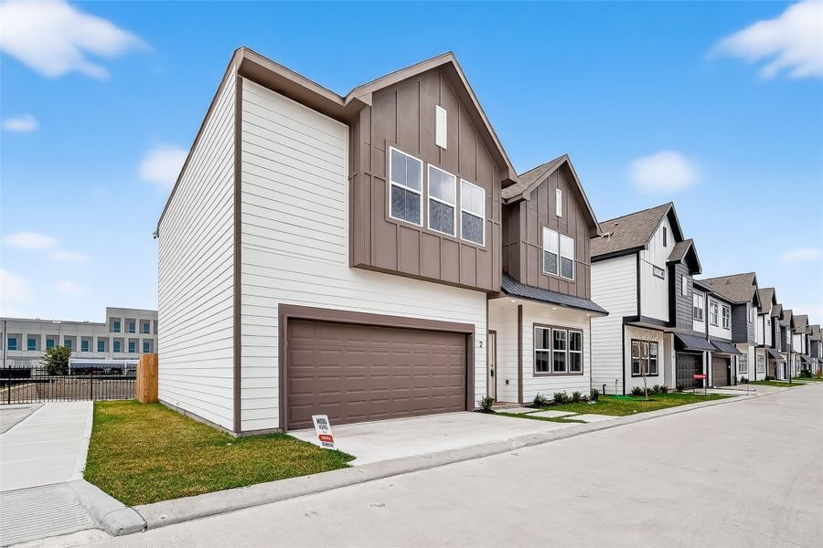 Front exterior of a new home in Metro Village, Houston, TX, highlighting curb appeal (Image 22).