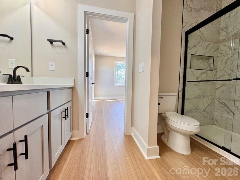 Primary Bath with Tile Shower.