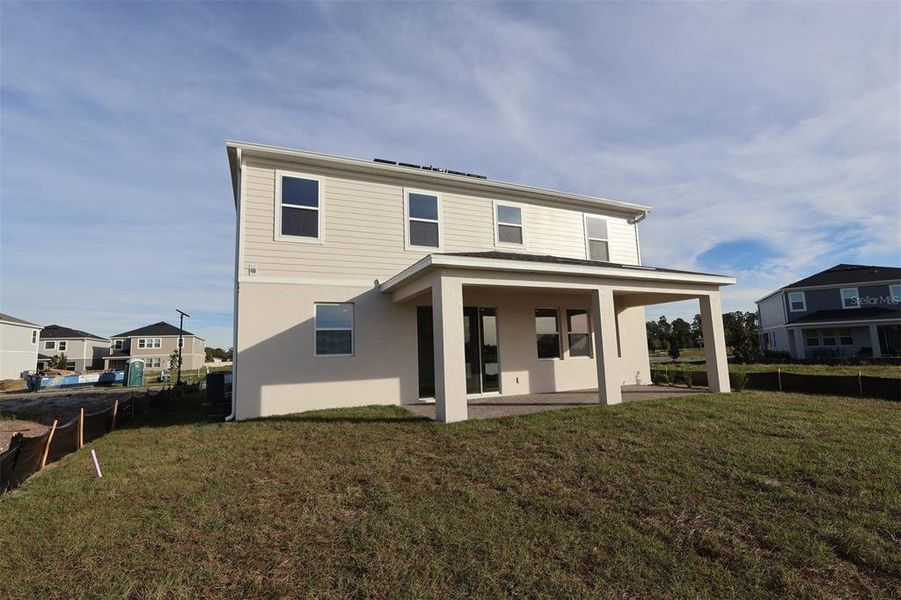 Exterior details and patio area of a home in Bay Lake Farms, St. Cloud (Image 4).