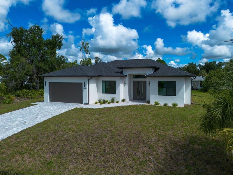 Front exterior of a new home in , North Port, FL, highlighting curb appeal (Image 29).