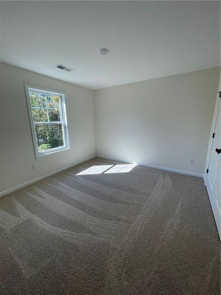 Spacious, unfurnished interior of a new home in Springwood Grove, Central (Image 20).