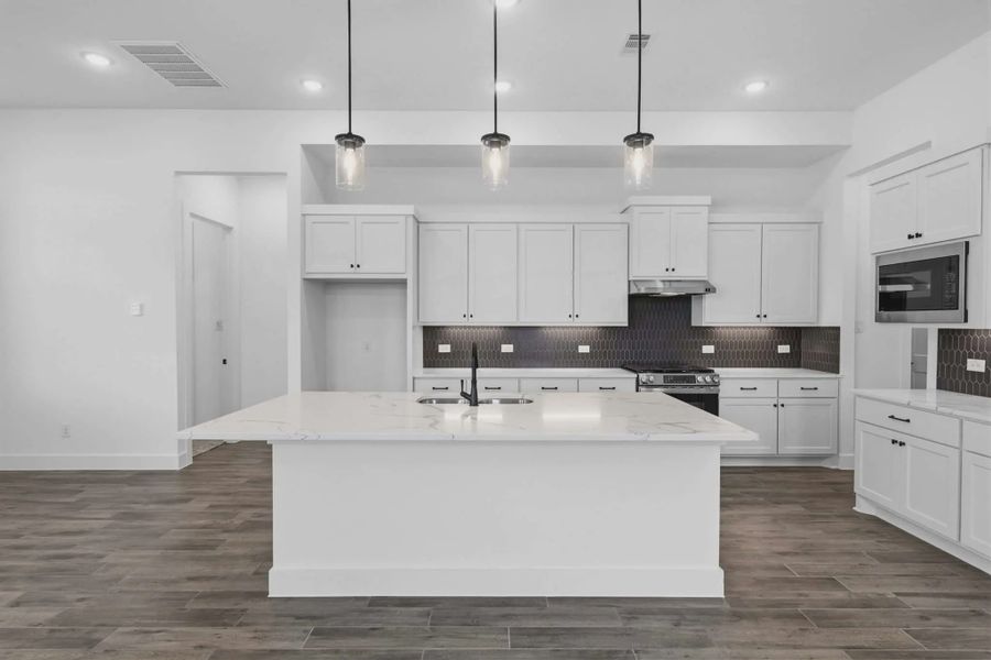 Representative furnished interior of a home built from the Sorenstam by Chesmar Homes in Riceland Alley Loads, Mont Belvieu (Image 13).