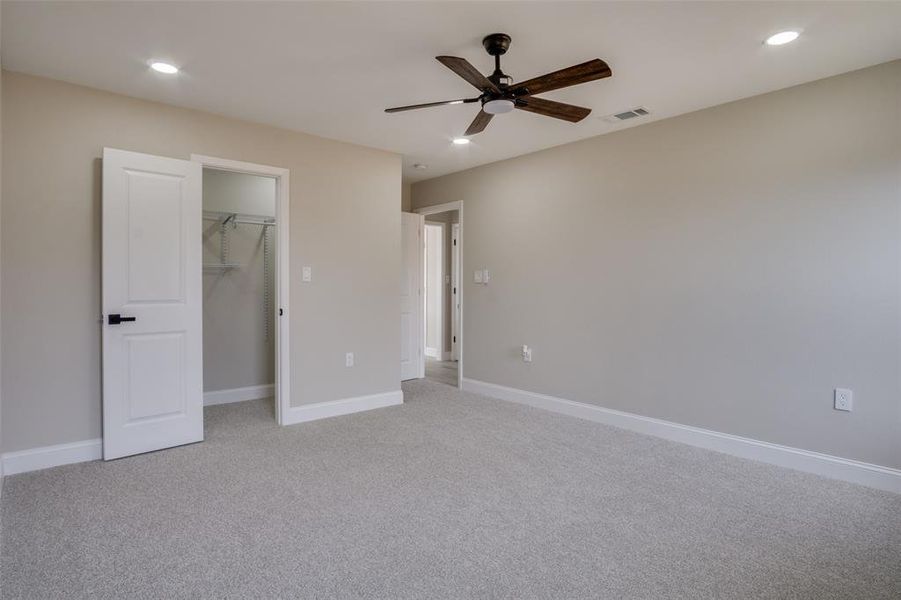 Unfurnished bedroom featuring recessed lighting, visible vents, and baseboards