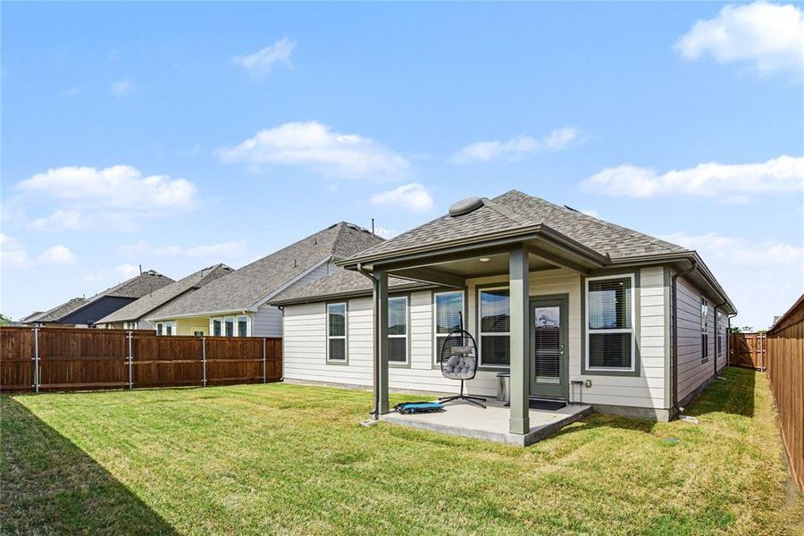 Exterior details and patio area of a home in Waterscape, Royse City (Image 21).
