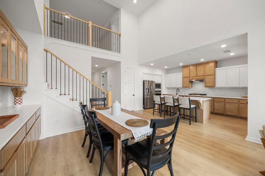 Such a large and open living space here. You have gorgeous built in lit cabinetry for all your china and buffet.