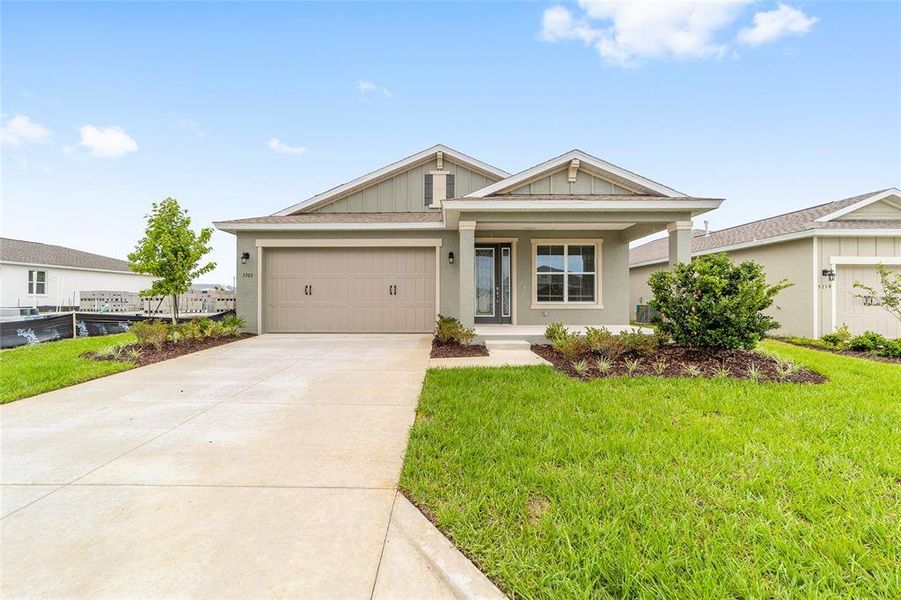 Front exterior of a new home in Calesa Township, Ocala, FL, highlighting curb appeal (Image 23). Front exterior of a new home in Calesa Township, Ocala, FL, highlighting curb appeal (Image 23).