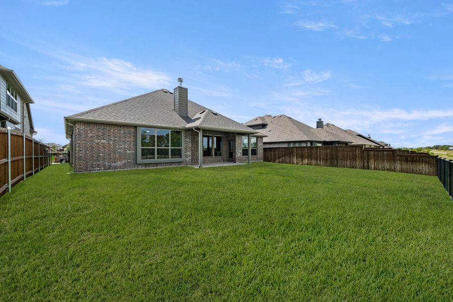 Exterior details and patio area of a home in Silo Mills, Joshua (Image 21).