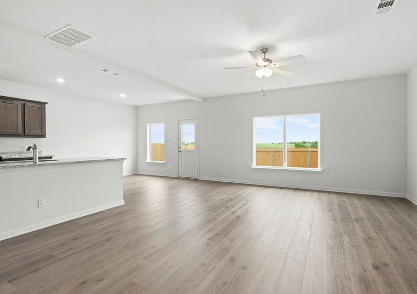 The family room has a large window that lets in great, natural light.