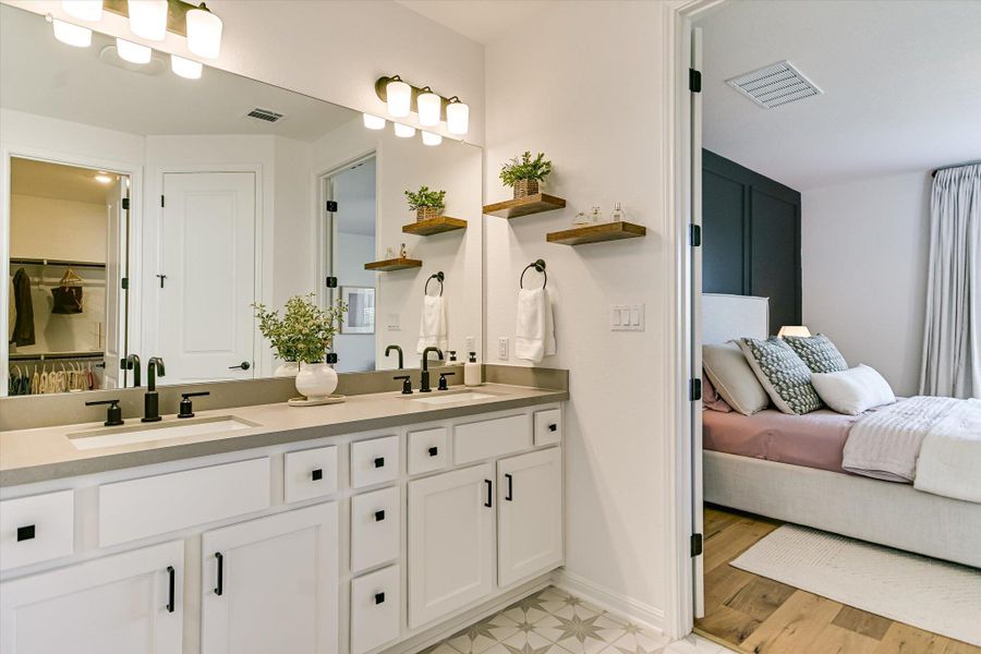 The ensuite primary bathroom has plenty of room for two people to get ready for work in the morning without getting in each other's way.