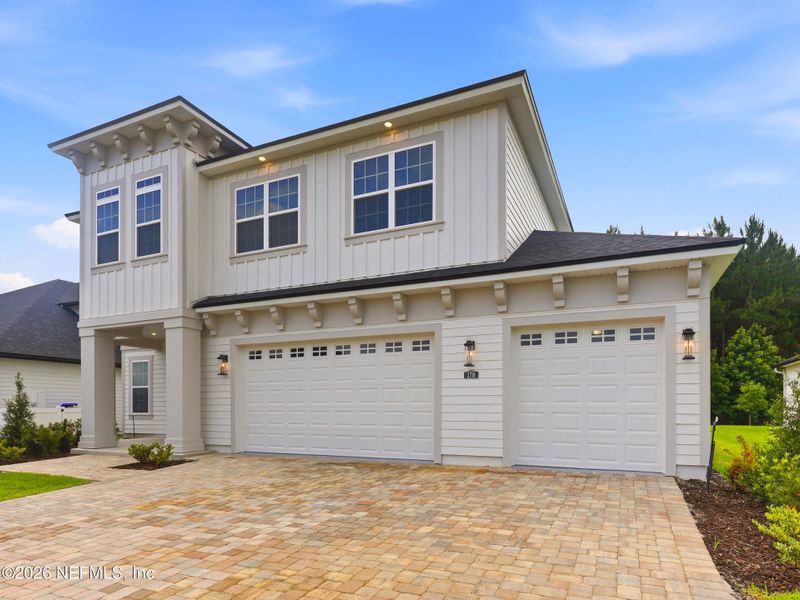 Front exterior of a new home in Silver Landing At Silverleaf, St. Augustine, FL, highlighting curb appeal (Image 27).