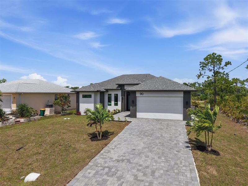 Front exterior of a new home in , Placida, FL, highlighting curb appeal (Image 18).