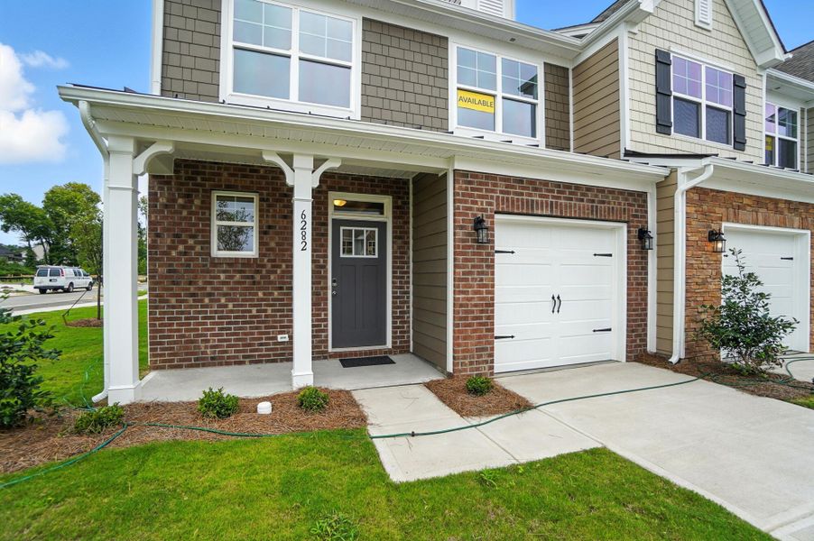 Front exterior of a new home in Harrisburg Village Townhomes, Harrisburg, NC, highlighting curb appeal (Image 27). Front exterior of a new home in Harrisburg Village Townhomes, Harrisburg, NC, highlighting curb appeal (Image 27).