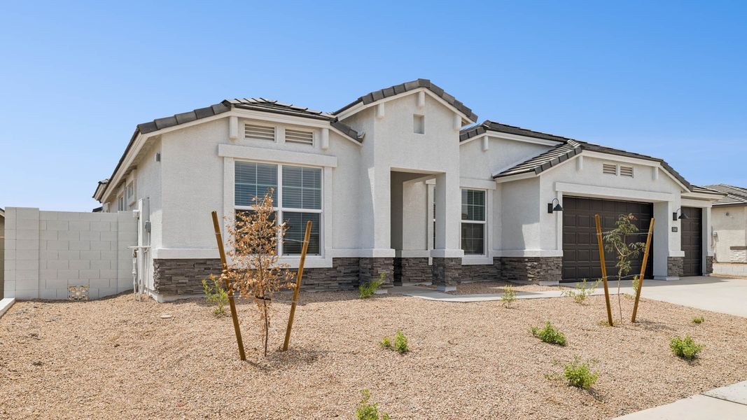 Front exterior of a new home in Zanjero Pass, Waddell, AZ, highlighting curb appeal (Image 2).