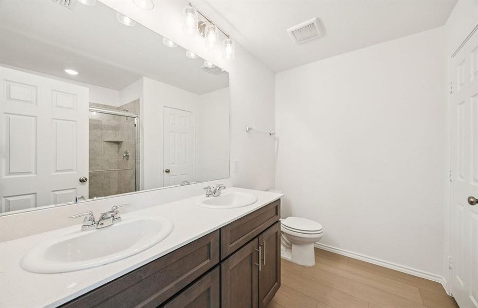 Owner's private bath with double vanity