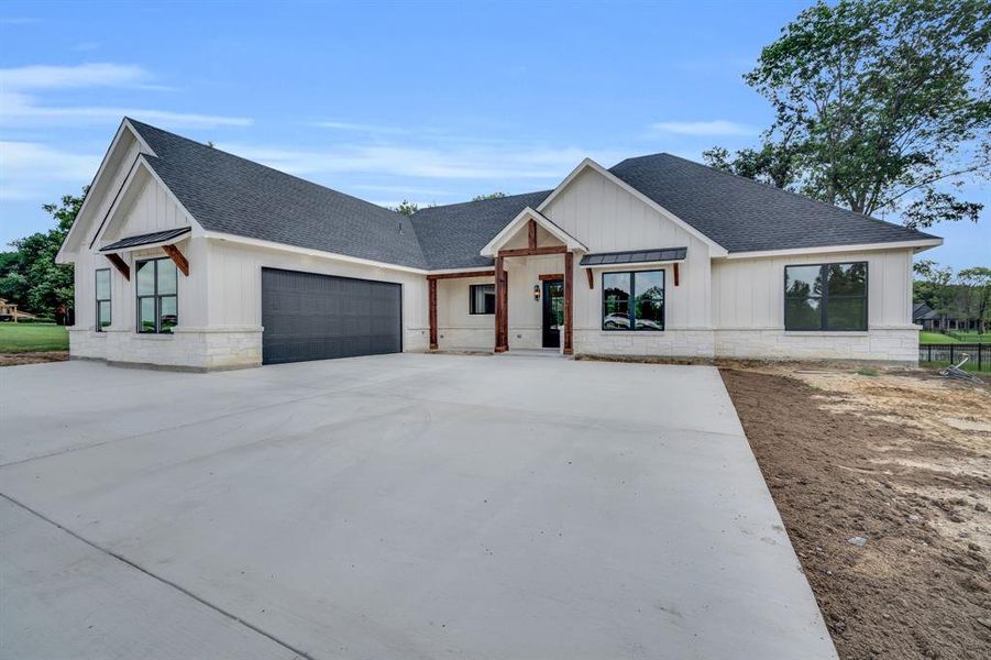 Modern inspired farmhouse with a garage