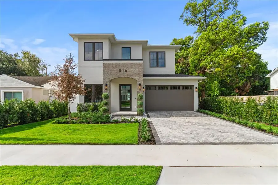 Front exterior of a new home in , Orlando, FL, highlighting curb appeal (Image 2). Front exterior of a new home in , Orlando, FL, highlighting curb appeal (Image 2).
