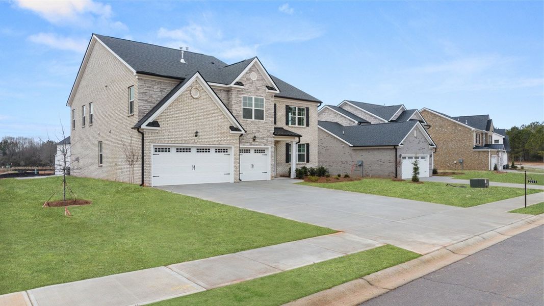 Front exterior of a new home in The Gates at Pates Creek, Hampton, GA, highlighting curb appeal (Image 24).