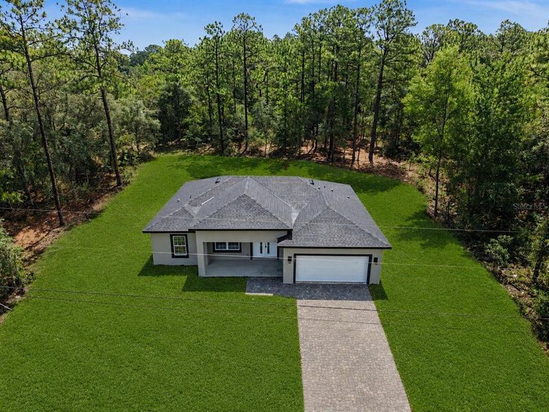 Front exterior of a new home in , Citrus Springs, FL, highlighting curb appeal (Image 25).