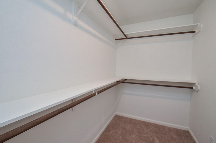 If organization is your love language, this walk-in closet delivers real storage you can grow into. If organization is your love language, this walk-in closet delivers real storage you can grow into.