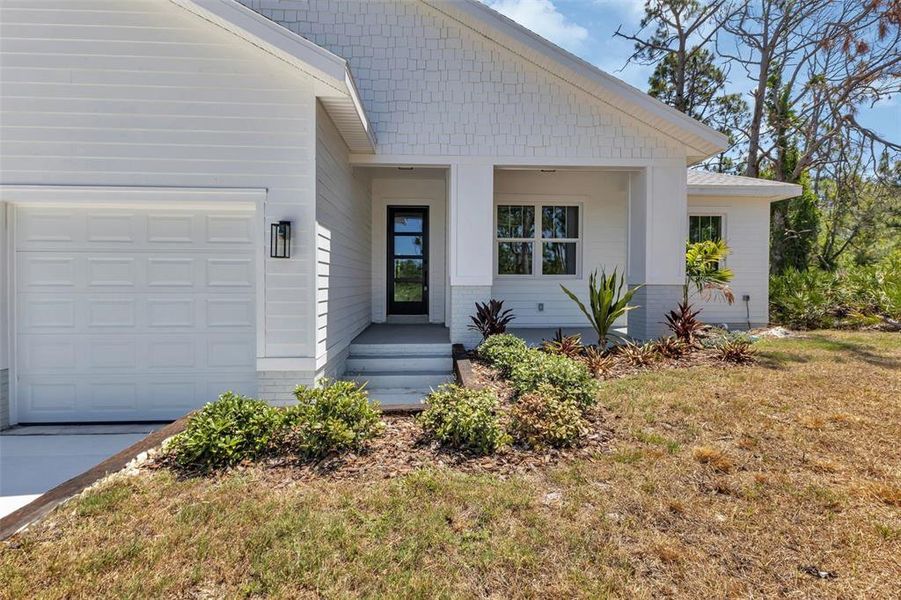Front exterior of a new home in , Port Charlotte, FL, highlighting curb appeal (Image 25).
