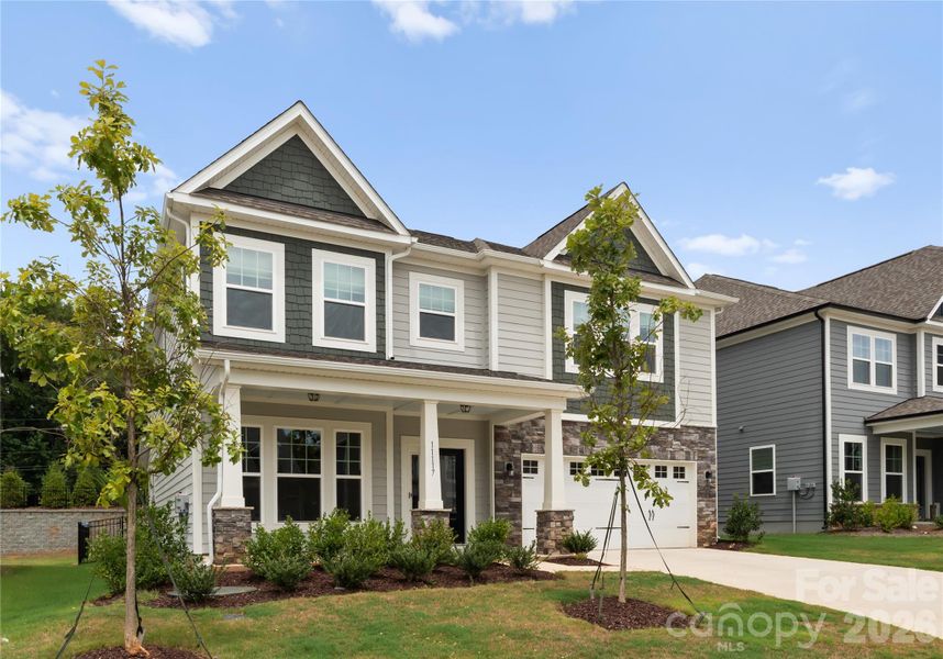 Front exterior of a new home in Avienmore, Charlotte, NC, highlighting curb appeal (Image 25). Front exterior of a new home in Avienmore, Charlotte, NC, highlighting curb appeal (Image 25).