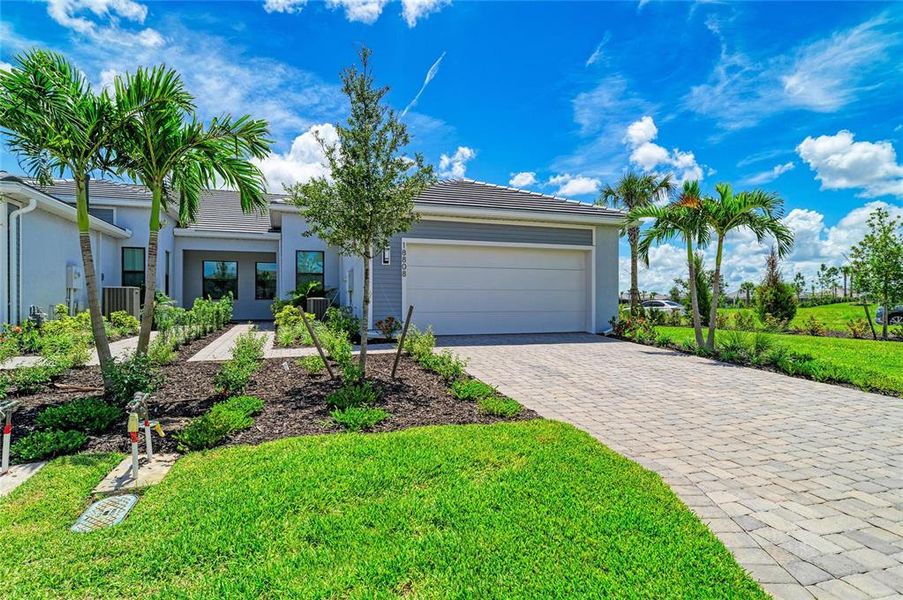 Front exterior of a new home in , Lakewood Ranch, FL, highlighting curb appeal (Image 2). Front exterior of a new home in , Lakewood Ranch, FL, highlighting curb appeal (Image 2).