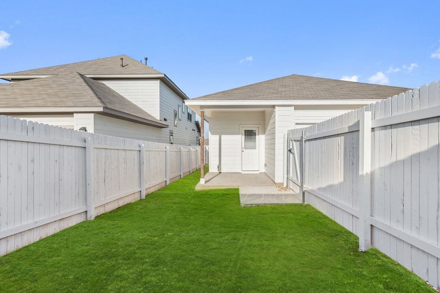 Front exterior of a new home in Sage Hollow, Kyle, TX, highlighting curb appeal (Image 17). Front exterior of a new home in Sage Hollow, Kyle, TX, highlighting curb appeal (Image 17).