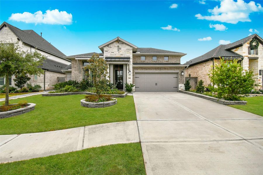 Front exterior of a new home in Cross Creek West 55', Fulshear, TX, highlighting curb appeal (Image 25).
