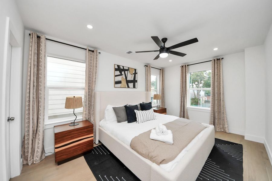 Secondary bedroom #3 shares the bathroom with bedroom #2. It features three large windows for natural light, and a ceiling fan for comfort. Secondary bedroom #3 shares the bathroom with bedroom #2. It features three large windows for natural light, and a ceiling fan for comfort.