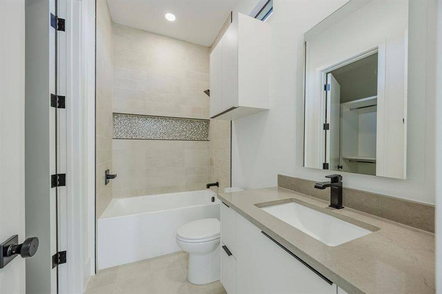 Full bathroom with vanity, shower combination, and recessed lighting Full bathroom with vanity, shower combination, and recessed lighting