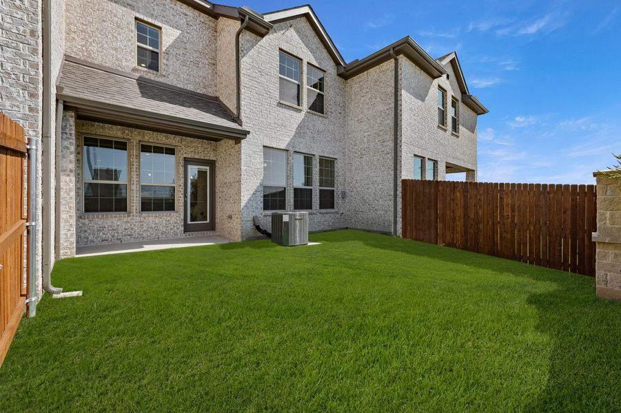 Front exterior of a new home in Main Street Village, Mansfield, TX, highlighting curb appeal (Image 27). Front exterior of a new home in Main Street Village, Mansfield, TX, highlighting curb appeal (Image 27).