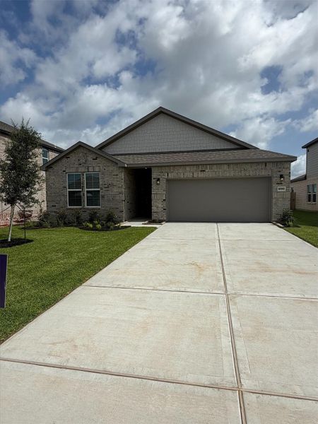 Front exterior of a new home in Pearlbrook, Texas City, TX, highlighting curb appeal (Image 2). Front exterior of a new home in Pearlbrook, Texas City, TX, highlighting curb appeal (Image 2).