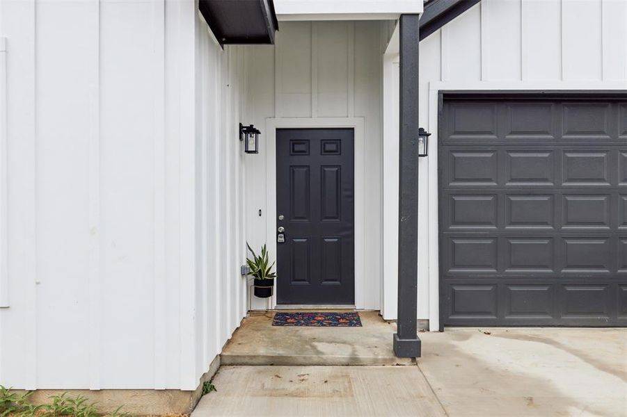 Entrance to property with a garage