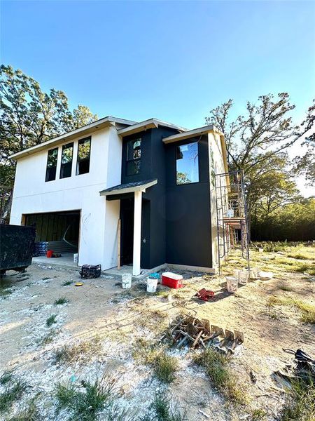 View of front of house with stucco siding and an attached garage View of front of house with stucco siding and an attached garage