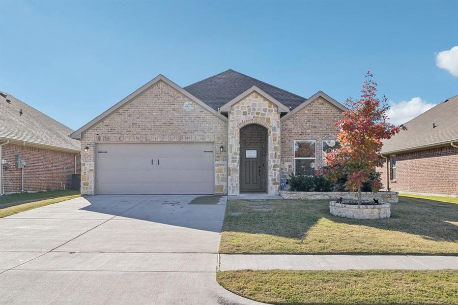 Front exterior of a new home in , Greenville, TX, highlighting curb appeal (Image 1). Front exterior of a new home in , Greenville, TX, highlighting curb appeal (Image 1).