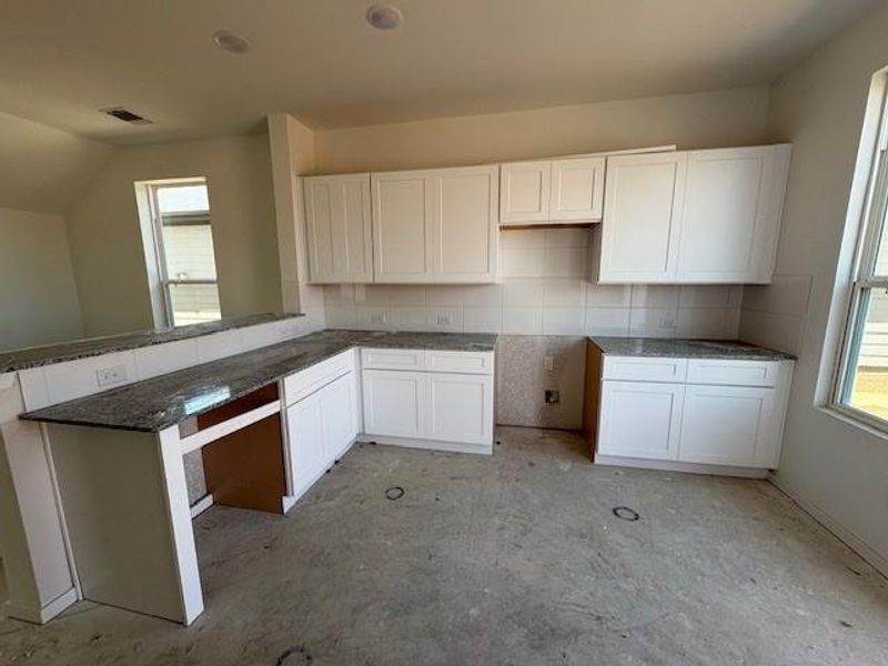 Another view of the Kitchen – Tile backsplash and Granite Countertops