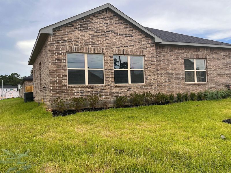 Front exterior of a new home in , Spring, TX, highlighting curb appeal (Image 20).