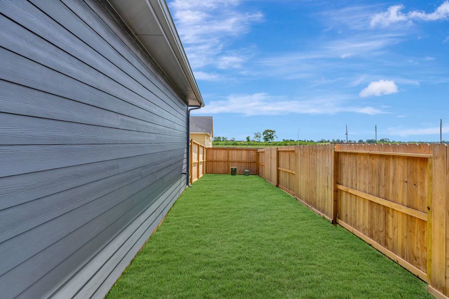 Exterior details and patio area of a home in Sienna - Landmark Row Collection, Missouri City (Image 3). Exterior details and patio area of a home in Sienna - Landmark Row Collection, Missouri City (Image 3).