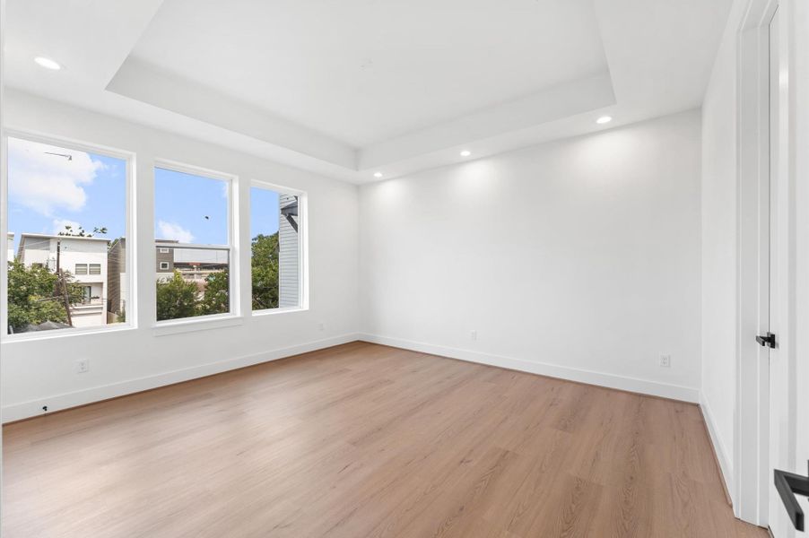 Primary bedroom with tray ceiling Primary bedroom with tray ceiling