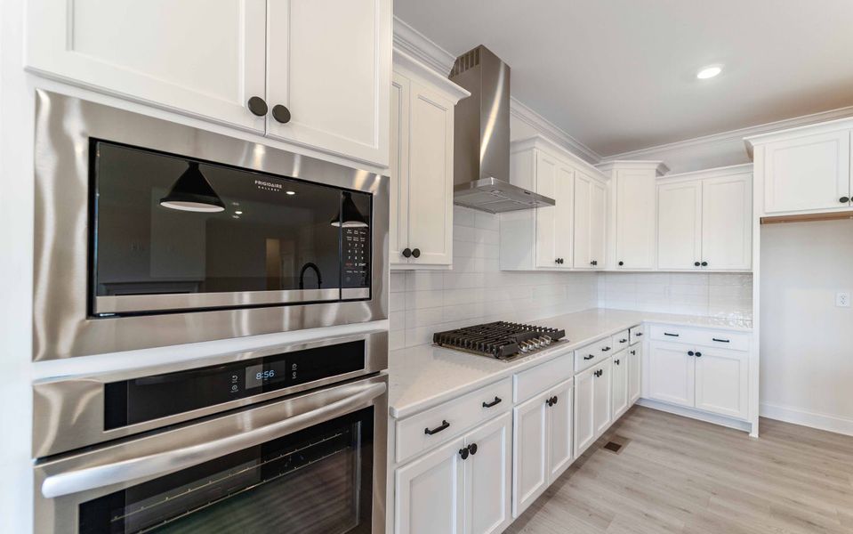Furnished interior view inside a new home in Aden Woods, Fairview (Image 7).