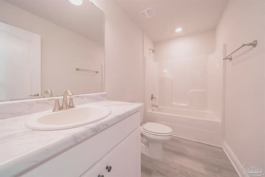 Representative unfurnished interior of a home built from the Plan 1645 by Adams Homes in Westpointe Place, Pensacola (Image 12).