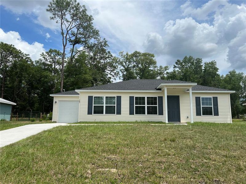 Front exterior of a new home in , Ocklawaha, FL, highlighting curb appeal (Image 1). Front exterior of a new home in , Ocklawaha, FL, highlighting curb appeal (Image 1).