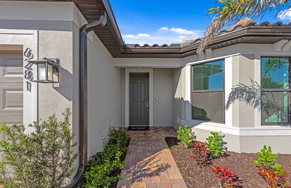 Exterior details and patio area of a home in Del Webb Naples, Ave Maria (Image 3).
